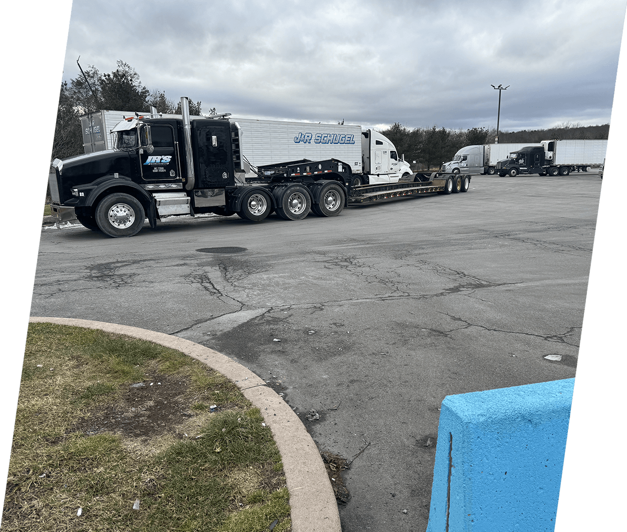 A large truck is parked in the parking lot.