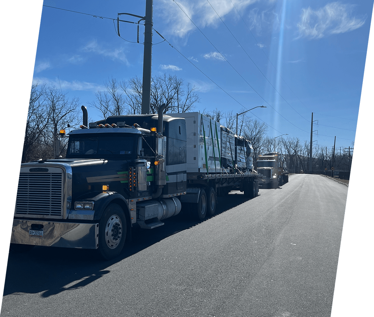 A large truck is driving down the street.