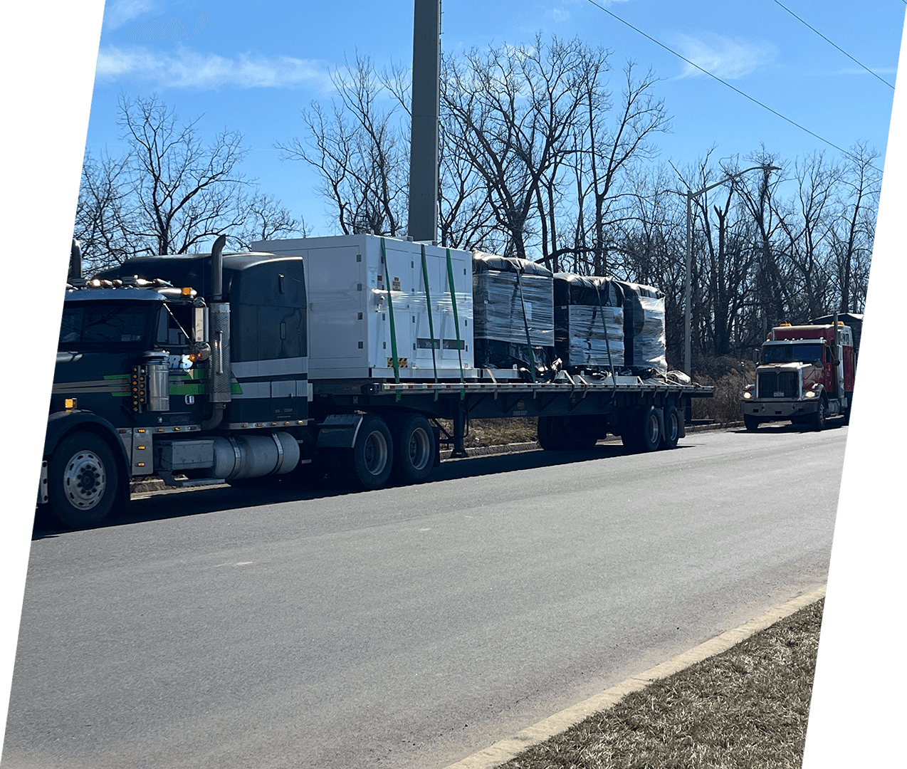 A large truck is driving down the road.