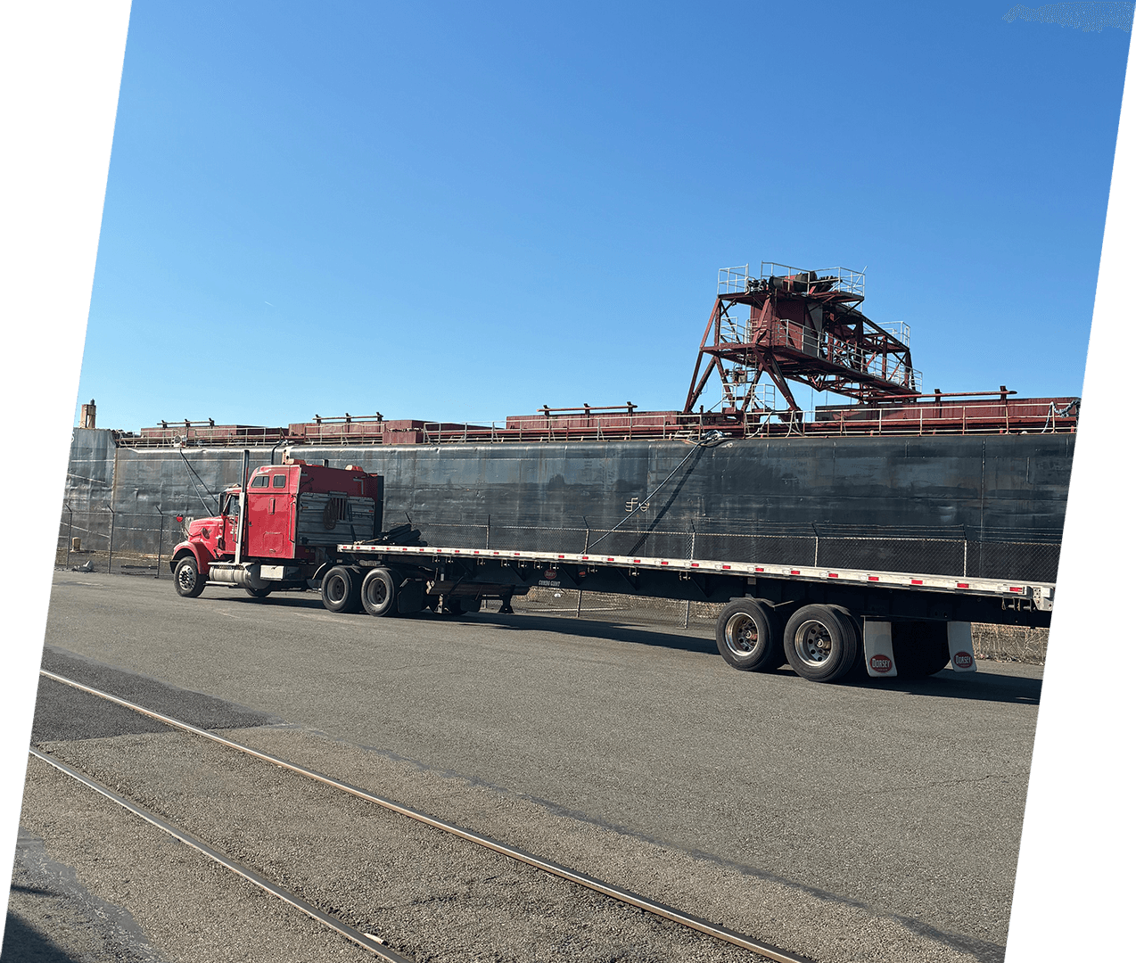 A large truck is driving down the road.