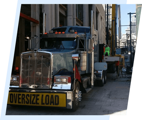 A large truck is parked on the side of the road.