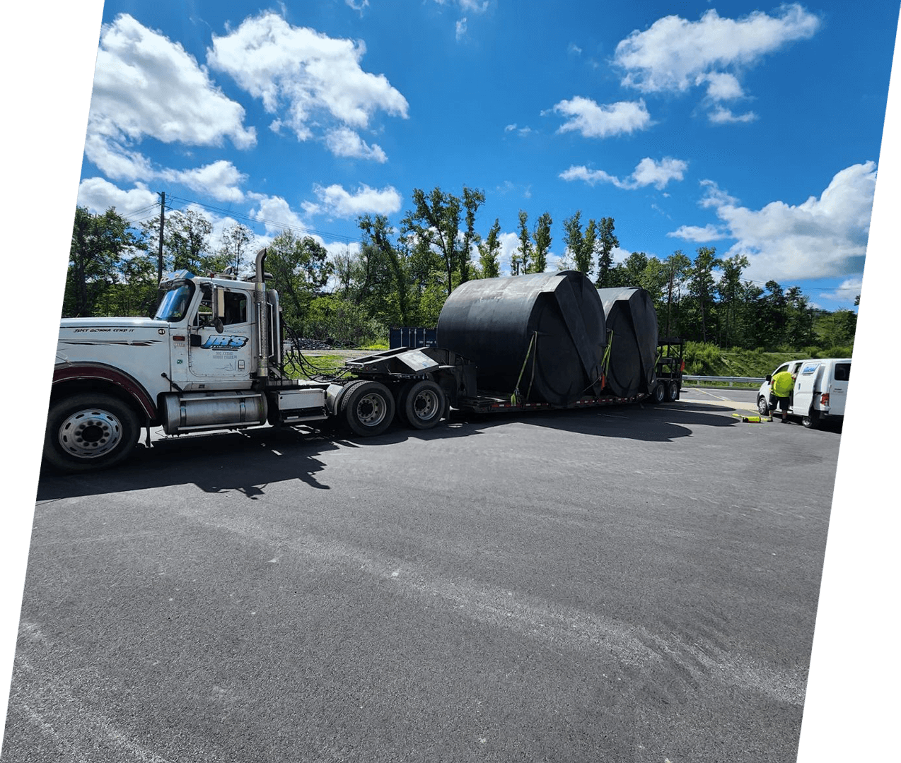 A large truck is parked in the parking lot.