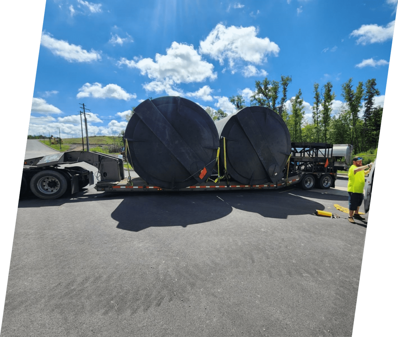 A large truck with two large tires on it.