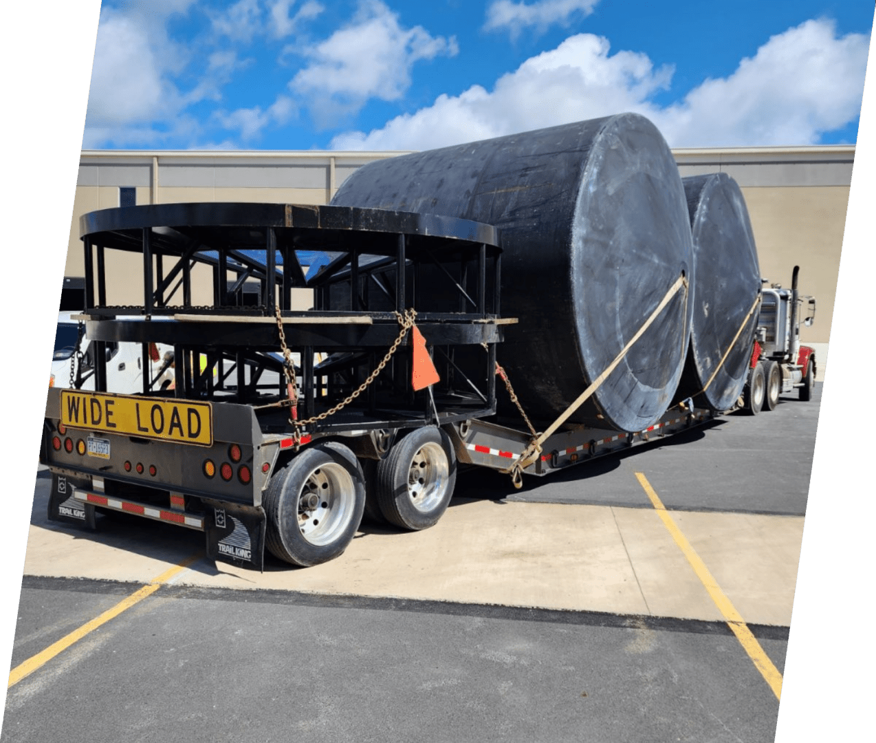 A large truck is parked in the parking lot.