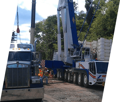 A crane is being used to lift a truck.