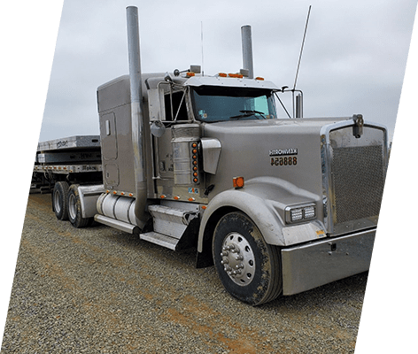 A large truck is parked on the side of the road.